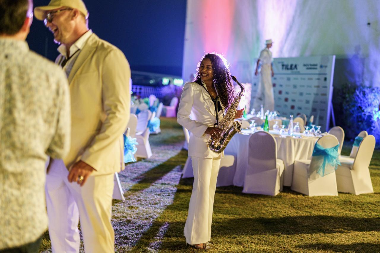 Saxophone performer greeting TurfEducation guests